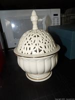 Domed lidded Lenox bowl front view showing pierced lid and gold trim