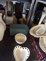 Overall view showing three Lenox reticulated dishes on shelf