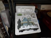 Ceramic house in styrofoam packing