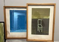 Both framed watercolours side by side