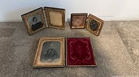 Six Victorian photo cases displayed—three open showing portraits and interiors, three closed