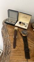 Overall lot showing two watch straps, cuff links in boxes and tie clips