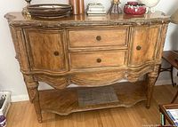 Full view of Schnadig buffet showing drawers, doors, marble edge, lower shelf