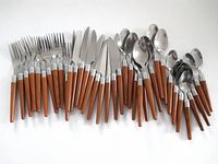 All 38 pieces laid out showing utensil types and faux wood handles