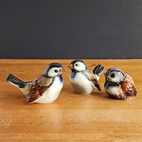 Front view of three Goebel porcelain birds