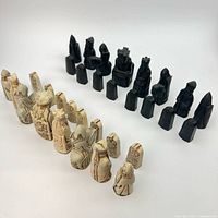 Full layout of cream and dark Isle of Lewis chess pieces