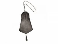 Full view of soldered metal mesh wristlet purse with chain handle and tassel