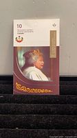 Front view of unopened 2012 Canada Post booklet showing Queen Elizabeth II Diamond Jubilee design and 10-stamp count