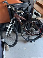 Full view of Norco mountain bike leaning against object