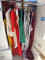Rack with fourteen assorted dresses and gowns