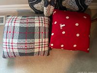 Plaid and polka dot pillows together