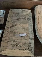 Rectangular platter close-up showing birch imprint texture and glaze