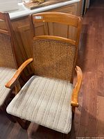 Armchair with cane back and upholstered seat