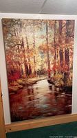 Full view of large autumn forest stream canvas print leaning against wall