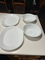 Top view of Corelle platters and bowls showing blue rim