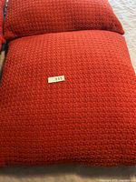 Close-up of woven texture and color of one pillow