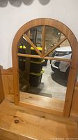 Arched pine mirror with windowpane muntins