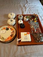 All items together in tray including pumpkins, napkins, plate, potpourri bags