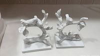 Pair of white ceramic branch-and-bird bookends