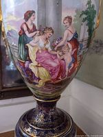 Front showing classical figural scene, cobalt neck and base