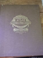 Front cover showing gilt title and brown cloth boards