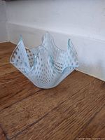 Front view showing checker pattern and fluted rim