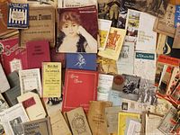 Overview of assorted booklets, sheet music and pamphlets spread out