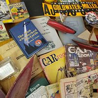 Overview of books, magazines, maps, red runners, and survival booklet