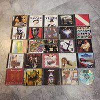 Full 5×5 grid of 25 CDs; shows all cases and loose Nirvana disc