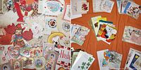 Assorted vintage greeting cards and Valentine items laid out, showing quantity and variety