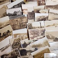 Scattered view of entire grouping of photo postcards showing variety of scenes