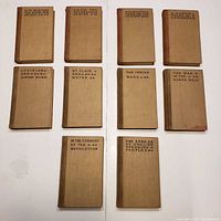 Front covers of all ten volumes laid out