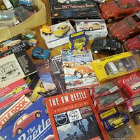 overview of boxed and loose diecast cars with books grouped below