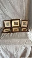 All six framed miniature plaques displayed, two rows
