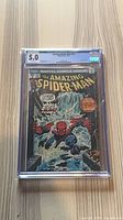 Front view of CGC-encased The Amazing Spider-Man #151 showing grade 5.0.