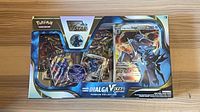 Front of sealed Dialga VSTAR Premium Collection box showing promo cards, booster packs, coin and box art