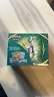 Top view of sealed Pokémon TCG collector bundle box featuring Arceus artwork