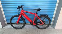 Full side view of red Stromer e-bike