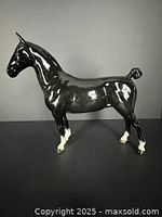 Left side view of glossy black Beswick Hackney Horse figurine