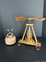 Full view of both nativity items: pyramid and music box