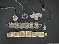 All five jewellery items laid out