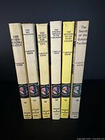 Spines of all six Nancy Drew hardcover books showing titles and series numbers