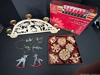 All items in lot: wooden candle holder, boxed straw ornaments, boxed red LED lights, glass ornaments