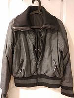 Grey micro-check side front view displaying full zip, ribbed collar and hem