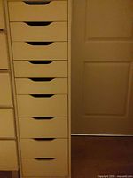 Full view of white nine-drawer storage cabinet