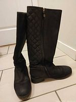 Boots standing upright showing outer sides, quilted shaft and overall appearance