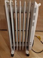 Side view of full heater showing 7 fins and casters