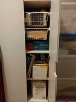 Open cabinet showing adjustable shelves inside