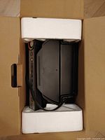 Grill packaged in box with foam inserts