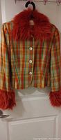 Front view of multicolor plaid cropped jacket showing faux-fur collar and cuffs